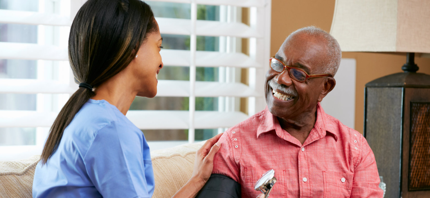 portrait of smiling nurse and happy patient