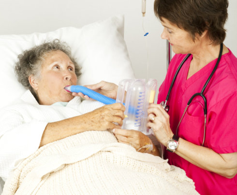 nurse feeding her patient on bed
