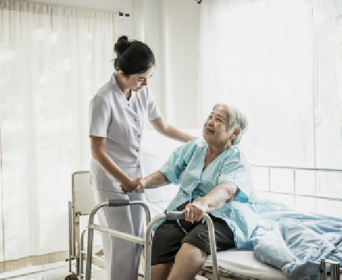 nurse assisting her patient on bed