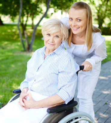 portrait of nurse and patient in wheelchair