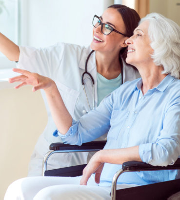 portrait of nurse and happy patient