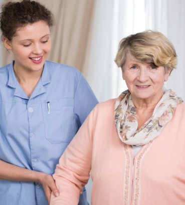 portrait of caregiver assisting her patient