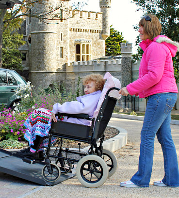 portrait of caregiver and patient on wheelchair