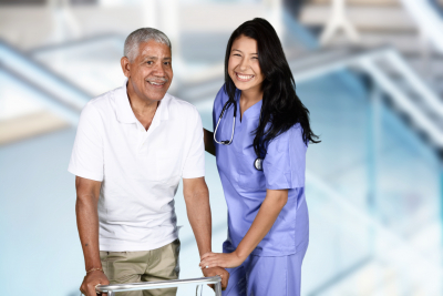 nurse giving physical therapy to an elderly patient